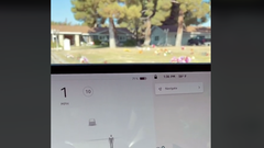 Tesla zaslon prikazuje duha na pokopališču.